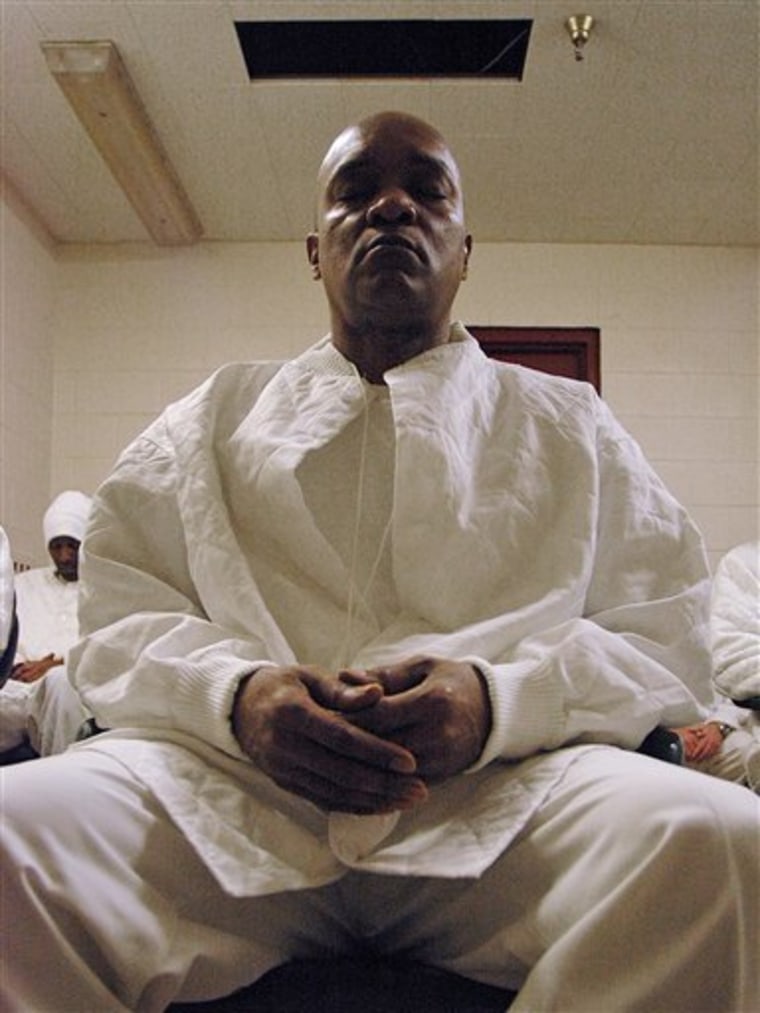 Ronald McKeithen, 48, who is serving life without parole for robbery, meditates with other inmates at William E. Donaldson prison in Bessemer, Ala., on Jan. 20. Deep inside an overcrowded prison with a reputation for mayhem, convicted killers, robbers and rapists gather in a small room. Eyes closed, they sit silently with their thoughts and consciences. 